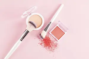 Beauty Tools Drucke: A flat lay of makeup essentials featuring a compact blush with two makeup brushes