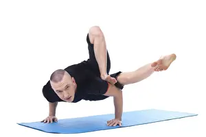Gymnastics Training Sport Drucke: Flexible middle-aged yogi posing looking at camera