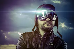 Vintage Pilot Drucke: Flight, man dressed as pilot in helmet on clouds background