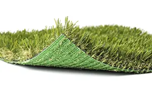 Artificial Turf Close Up Drucke: Flipped up section of artificial turf grass on white background