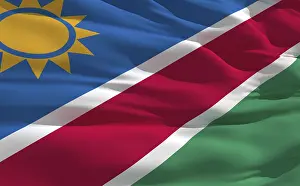 Empty Desert Landscapes Drucke: Fluttering flag of Namibia on the wind