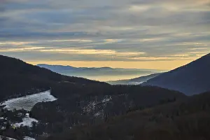 Sunset Atmosphere In Europe Drucke: Fog lying in a valley at sunset