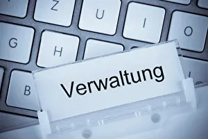 German Politics Drucke: The folder of a hanging file in front of a computer keyboard on the subject of administration Studio recording
