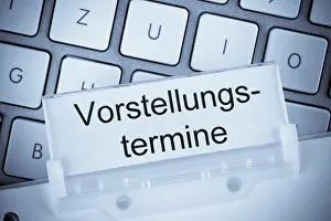 House Building Construction Drucke: The folder of a hanging file in front of a computer keyboard on the subject of performance dates studio recording