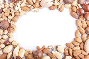 Healthy Eating Picture Drucke: Frame made from different kinds of nuts on white background