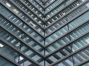 Contemporary Architectural Style Drucke: A full frame modern office architecture abstract with geometric angular reflected shapes