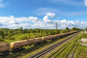 Deserted Train Station Drucke: The freight train passes by the station
