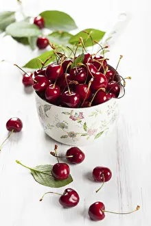 Stone Fruit Dessert Drucke: Fresh cherries in pot on the table