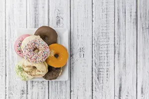 Top Down View Of Sweets Drucke: Some fresh made Donuts (view from above)