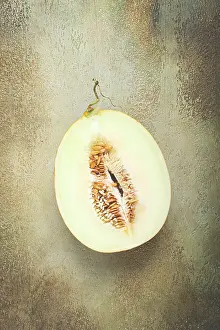 Top View Of Fruit Drucke: Fresh melon in section, half melon