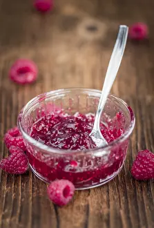 Country Style Breakfasts Drucke: Fresh made Raspberry Jam on an old and rustic wooden table