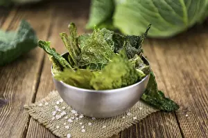 High Calorie Snack Food Drucke: Some fresh Savoy Chips (selective focus)