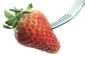 Fresh Strawberry Drucke: Fresh strawberry on a fork on a white background