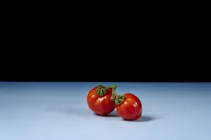 Fruit Vegetable Images Drucke: Two fresh tomatoes on blue background