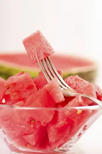 Raw Food Photography Drucke: Fresh watermelon on a white background