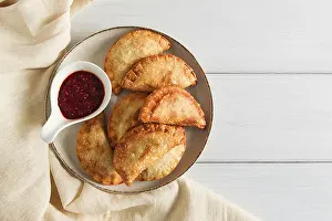 Fried Chebureks Drucke: Fried chebureks, close-up, on a light background