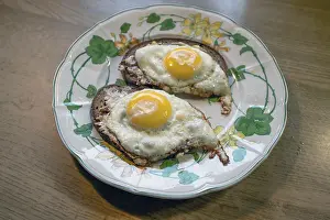 Bavaria Food Photography Drucke: Two fried eggs served on bread on a plate