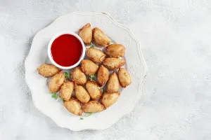 Fried Chebureks Drucke: Fried mini chebureks, with sauce