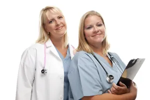 Medical Care Professionals Drucke: Two friendly doctors or nurses isolated on a white background