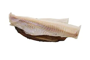 Drucke von Gefrorener Fischfilet aus Kabeljau auf weißem Hintergrund isoliert Kabeljau Im Atlantik Drucke: Gefrorener Fischfilet aus Kabeljau isoliert auf weißem Hintergrund.
