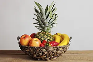 Fruity Still Life Photography Drucke: Fruit basket with a pineapple, apples