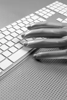 Uninhabited Workspace Image Drucke: Futuristic silver gray hand and computer keyboard