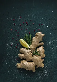 Fresh Ginger Drucke: Ginger root, on a dark background
