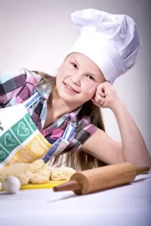 Young Girl In The Kitchen Drucke: Girl baking