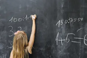 Educational Institution Setting Drucke: Girl solving math exercise