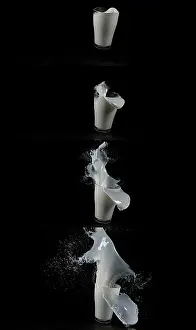 Black Background Food Photography Drucke: Glass for Milk exploding against Black Background