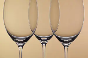 Wine Cellar Background Drucke: Three empty glasses of wine on a background
