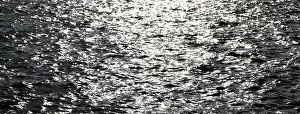 Deserted Water Surface Drucke: Glittering water surface with small waves