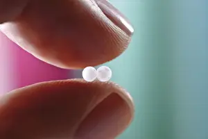 Homeopathic Remedy Drucke: Two globules held between fingers