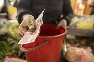 Colorful Street Scene Drucke: A gloved hand exchanges a banknote over a red container