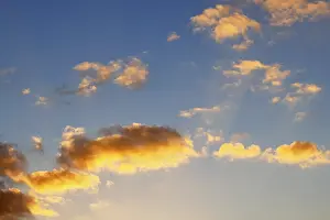 Evening Sun In Germany Drucke: Glowing clouds in the evening sky at sunset