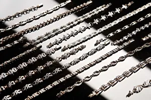 Traditional Craftsman Work Drucke: Golden bracelets on a studio background