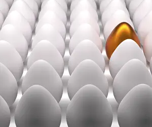 Colorful Easter Eggs Drucke: One golden Easter egg with many natural white eggs on a studio background