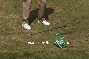 Recreational Golf Activity Drucke: Golfer practicing his swing at the range