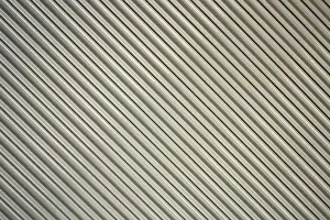 South American Architecture Drucke: A gray security shutter over the front of a building in Cotacachi