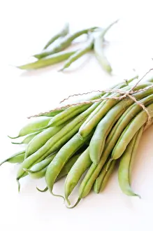 White Background Photography Drucke: Green beans on white background close up
