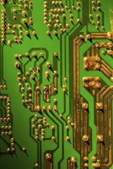 Green Circuit Board Drucke: Green and gold computer circuit board close-up