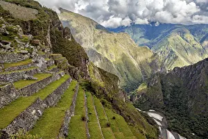 Riverine Landscape Photography Drucke: Green terraces over a river landscape under dramatic clouds