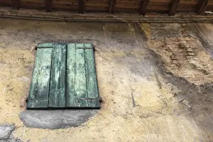 Deserted Countryside Scene Drucke: Green window on the rotten wall with space