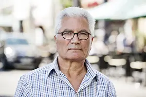 German Street Scene Drucke: Grey-haired Senior with migration background