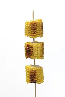 Sweet Corn Nutrition Drucke: Grilled corn on the corn cob on a skewer