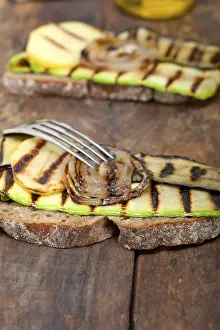 Gourmet Meal Ideas Drucke: Grilled vegetables on rustic bread over wood table