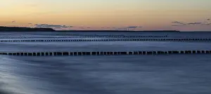 Deserted Coastline Germany Drucke: Groothing in the sea, sunset, long exposure