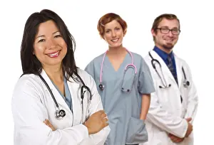 White Studio Background Photos Drucke: Group of doctors or nurses isolated on a white background