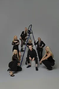 Elegant Studio Setting Drucke: A group of seven individuals is posing elegantly in a studio setting