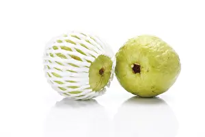 Fruity Still Life Photography Drucke: Two guavas, one packed in plastic